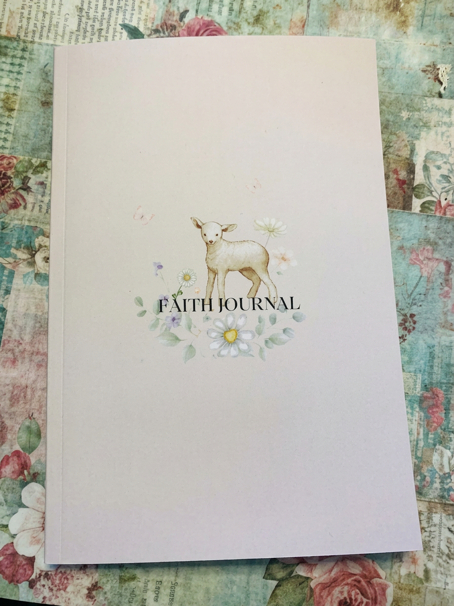 Sharon, founder of PrettyFlowerUK, holding the Faith Journal